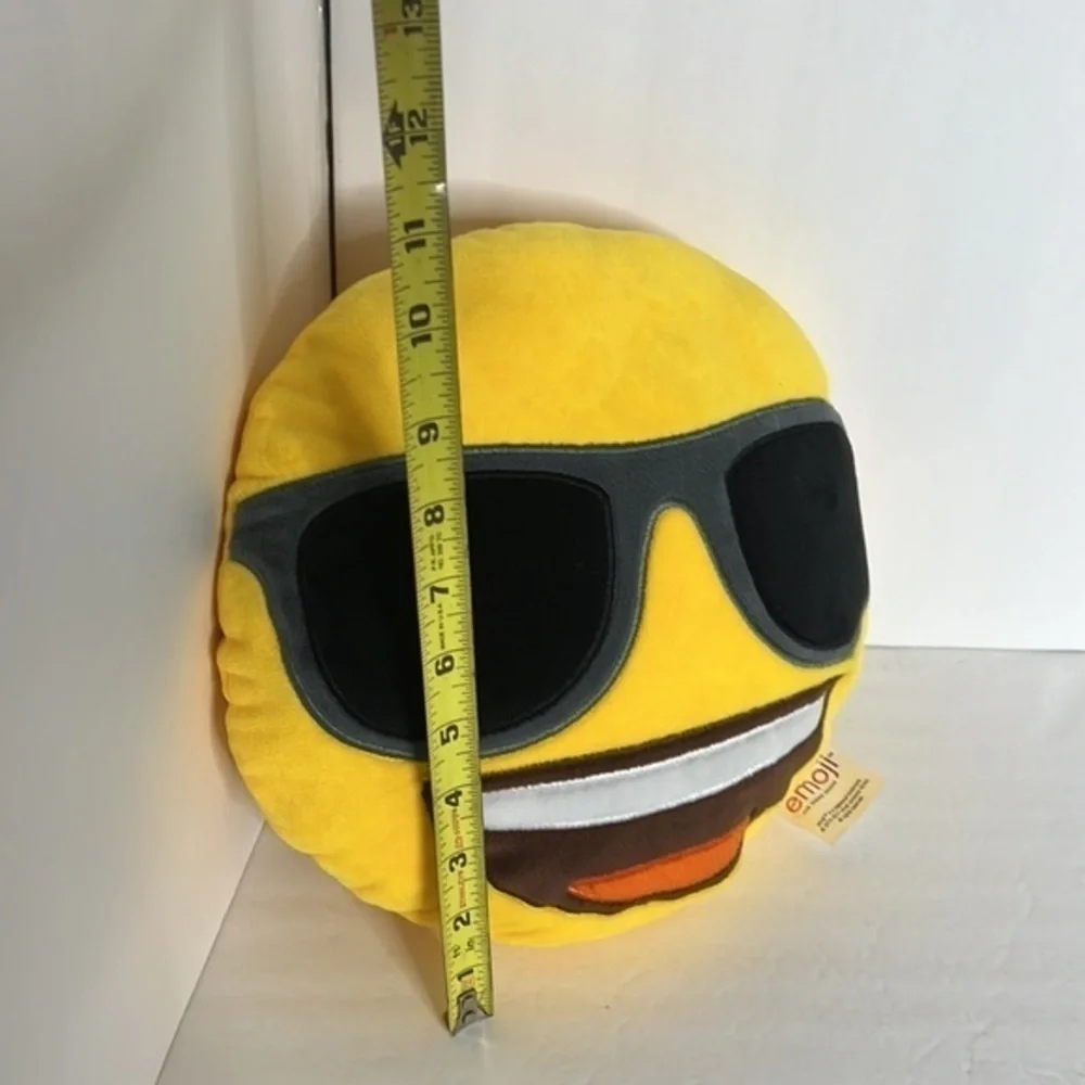 THE ICONIC BRAND EMOJI SMILE PILLOW WITH SUNGLASSES